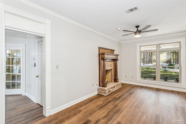 unfurnished living room with a fireplace, crown molding, wood-type flooring, and ceiling fan