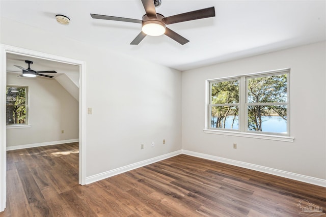 unfurnished room with ceiling fan and dark hardwood / wood-style flooring