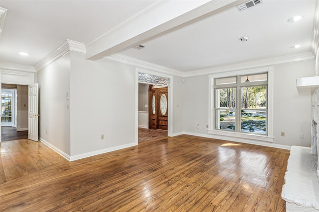 unfurnished living room featuring ornamental molding, a stone fireplace, and hardwood / wood-style floors