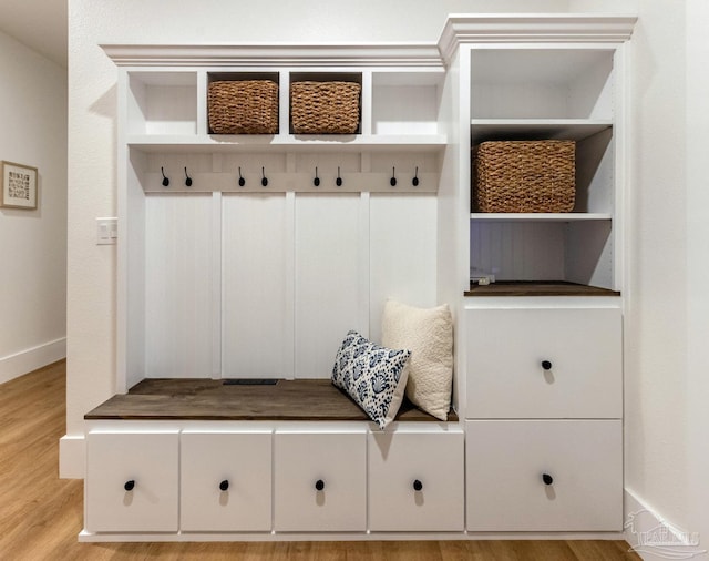 mudroom with light hardwood / wood-style floors