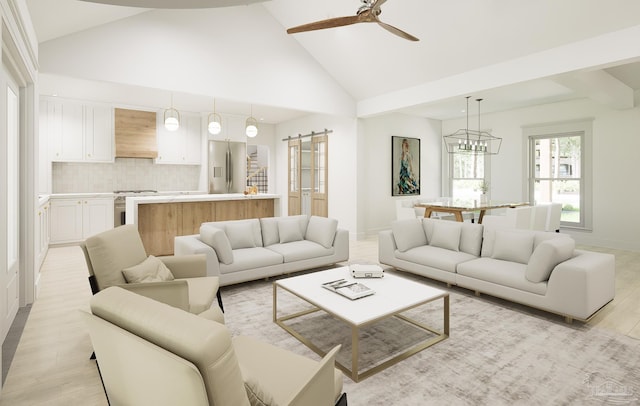 living room with a barn door, light wood-type flooring, ceiling fan with notable chandelier, and high vaulted ceiling