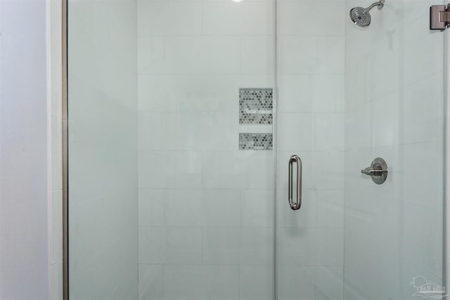 bathroom featuring a shower stall