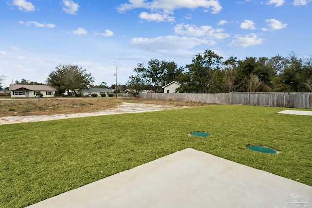 view of yard with a patio area and fence