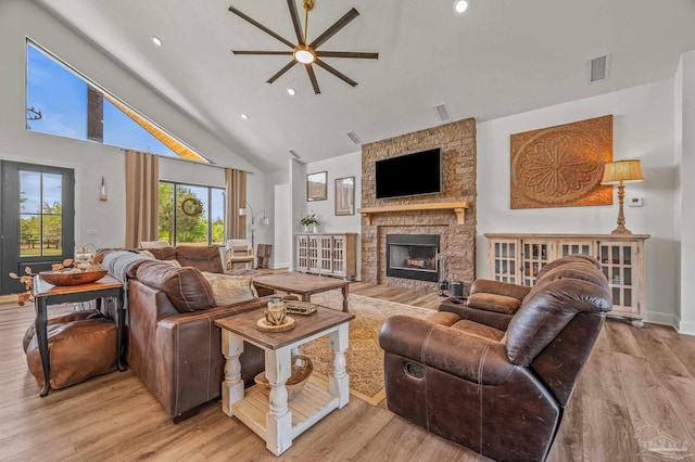 3720 Arbor Ridge Rd, Pace, FL 32571 - living area with a ceiling fan, visible vents, a fireplace, high vaulted ceiling, and light wood-style floors