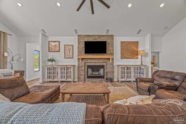 3720 Arbor Ridge Rd, Pace, FL 32571 - living room featuring visible vents, wood finished floors, a fireplace, ceiling fan, and vaulted ceiling