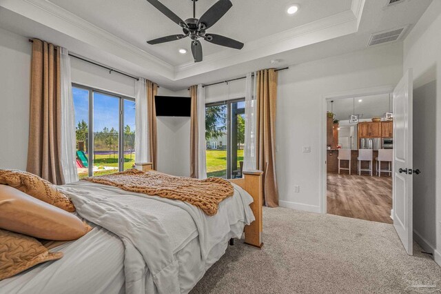 3720 Arbor Ridge Rd, Pace, FL 32571 - carpeted bedroom featuring access to exterior, visible vents, a raised ceiling, ornamental molding, and recessed lighting