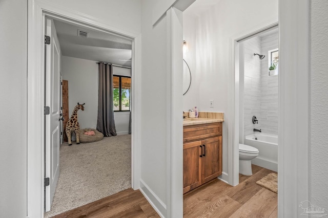 3720 Arbor Ridge Rd, Pace, FL 32571 - full bath featuring vanity, toilet, bathing tub / shower combination, wood finished floors, and visible vents