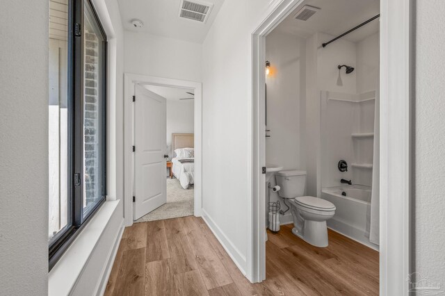 3720 Arbor Ridge Rd, Pace, FL 32571 - bathroom featuring  shower combination, toilet, wood finished floors, and visible vents