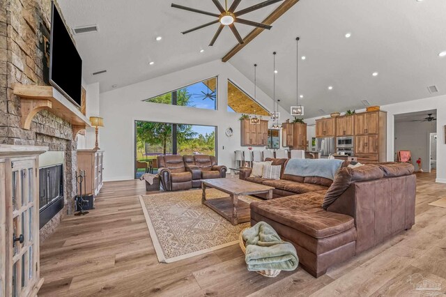 3720 Arbor Ridge Rd, Pace, FL 32571 - living room with ceiling fan, a fireplace, high vaulted ceiling, light wood-type flooring, and visible vents