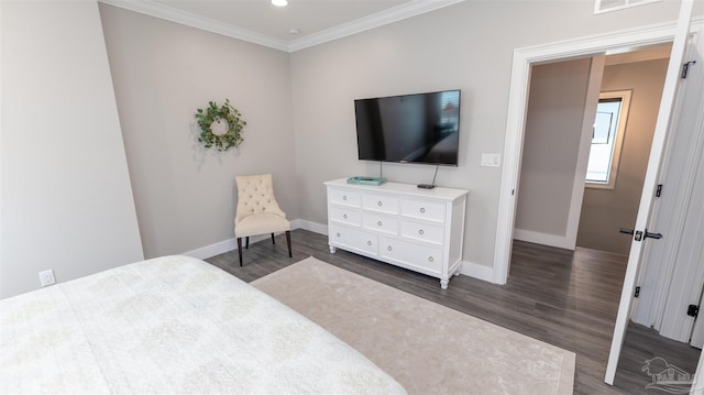 bedroom featuring dark wood-type flooring and ornamental molding