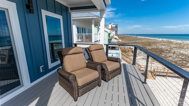 balcony with a view of the beach and a water view