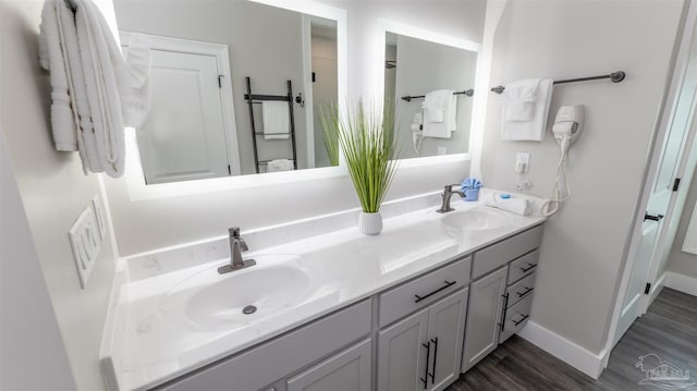 bathroom with vanity and hardwood / wood-style flooring