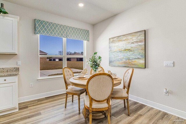 dining room featuring light hardwood / wood-style floors