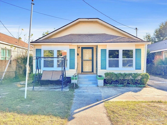 1007 W Wright St, Pensacola, FL 32501 - bungalow-style house with fence and roof with shingles
