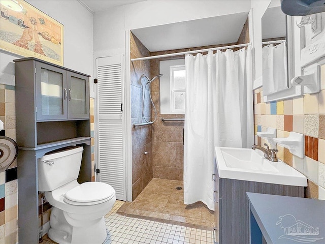 1007 W Wright St, Pensacola, FL 32501 - bathroom with toilet, a sink, tile patterned floors, and a tile shower
