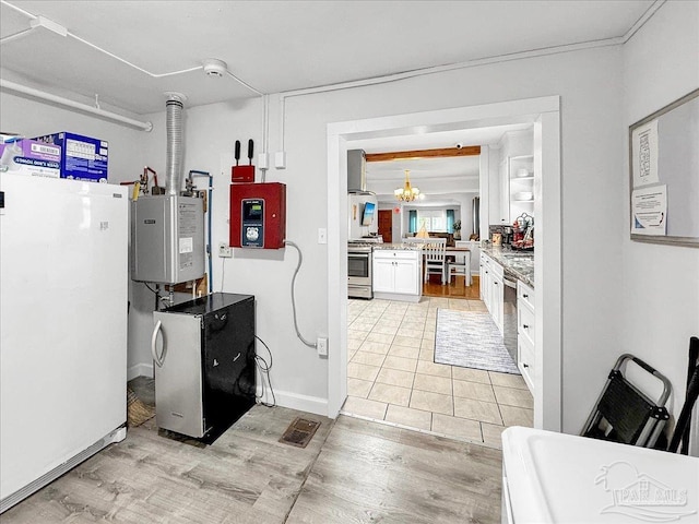 1007 W Wright St, Pensacola, FL 32501 - kitchen featuring a notable chandelier, light wood finished floors, stainless steel appliances, visible vents, and white cabinets