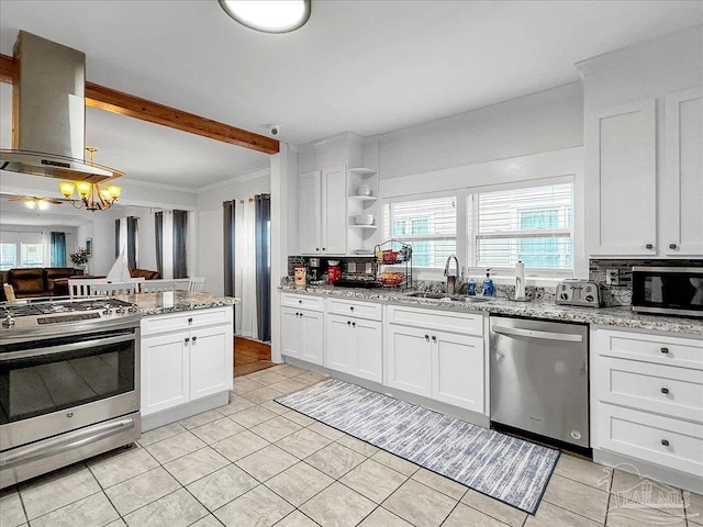 1007 W Wright St, Pensacola, FL 32501 - kitchen featuring white cabinetry, island range hood, a sink, and stainless steel appliances