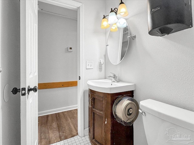 1007 W Wright St, Pensacola, FL 32501 - bathroom featuring toilet, vanity, and wood finished floors