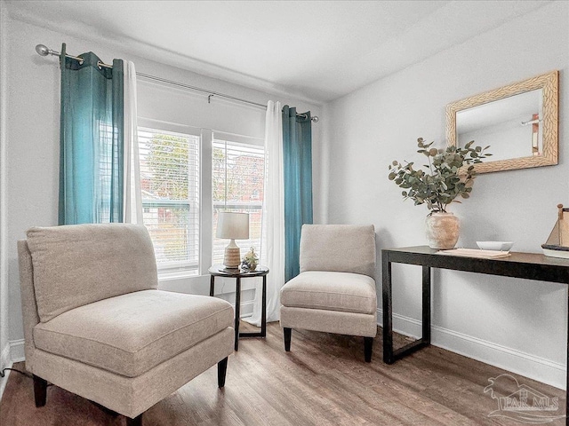 1007 W Wright St, Pensacola, FL 32501 - sitting room with baseboards and wood finished floors