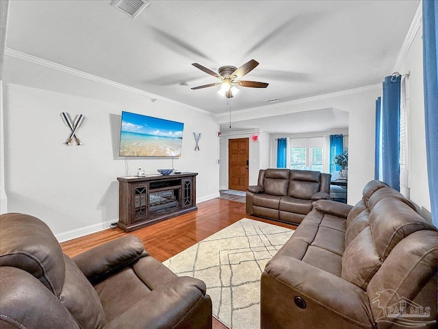 1007 W Wright St, Pensacola, FL 32501 - living area featuring ornamental molding, baseboards, visible vents, a ceiling fan, and wood finished floors