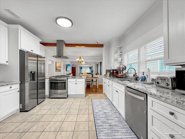 1007 W Wright St, Pensacola, FL 32501 - kitchen with visible vents, wall chimney exhaust hood, appliances with stainless steel finishes, a sink, and light tile patterned floors