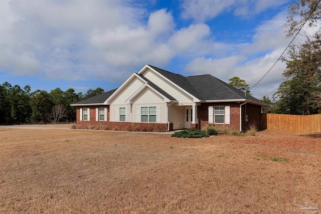 craftsman-style home featuring a front lawn