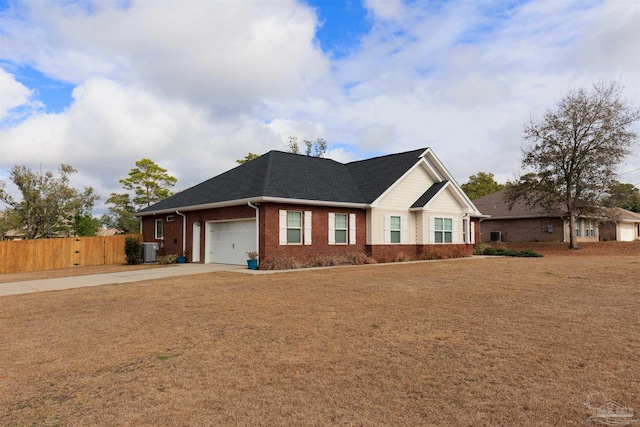 view of front of home with central AC and a garage