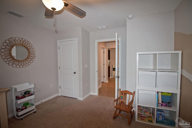 9453 Lutoo Ln, Pensacola, FL 32526 - playroom featuring ceiling fan, carpet floors, and baseboards