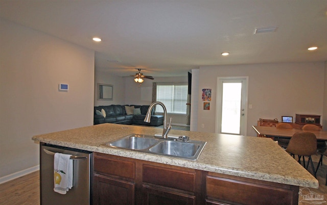 9453 Lutoo Ln, Pensacola, FL 32526 - kitchen featuring a sink, open floor plan, dark wood finished floors, stainless steel dishwasher, and light countertops