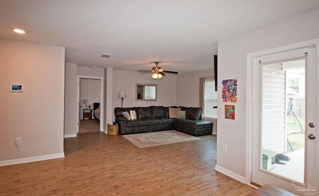 9453 Lutoo Ln, Pensacola, FL 32526 - living area featuring light wood-style floors, a ceiling fan, and baseboards