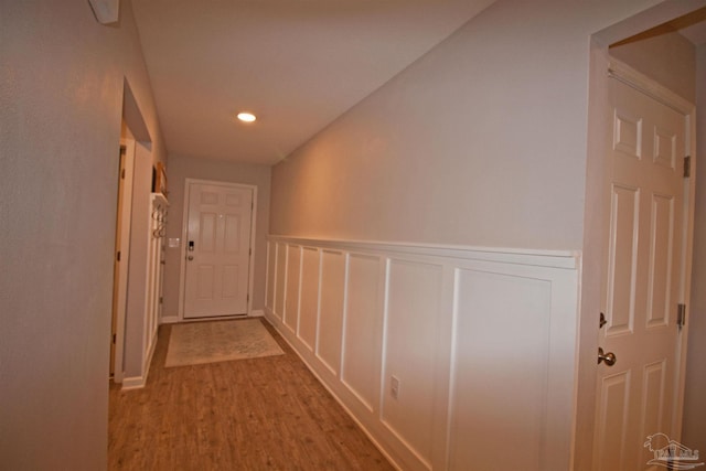 9453 Lutoo Ln, Pensacola, FL 32526 - corridor featuring wood finished floors, a wainscoted wall, recessed lighting, and a decorative wall