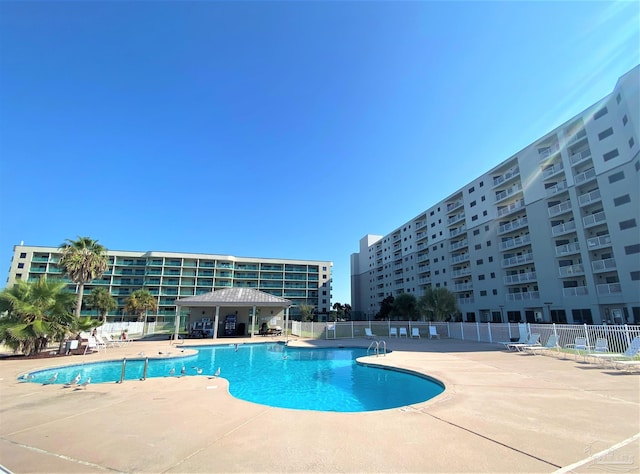 view of swimming pool with a patio