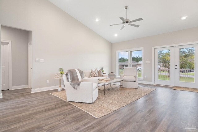 living room with high vaulted ceiling, french doors, ceiling fan, and hardwood / wood-style floors