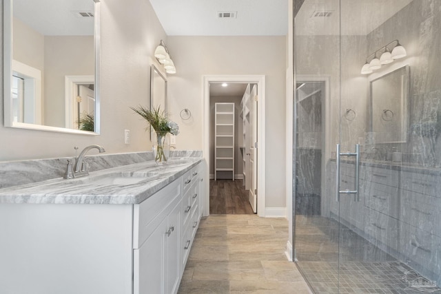 bathroom with vanity and walk in shower