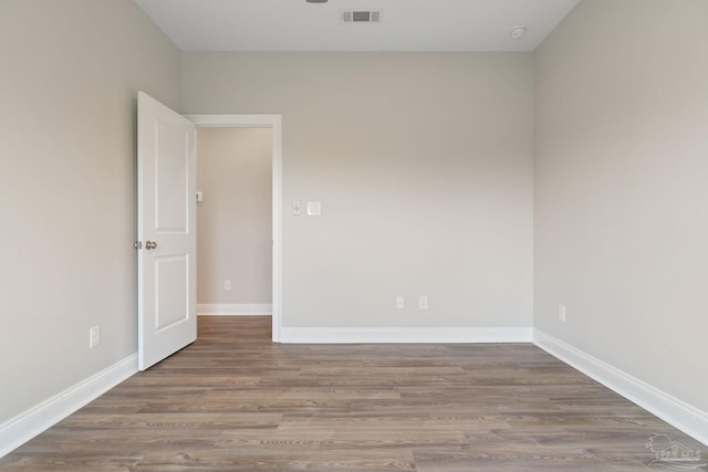 spare room featuring hardwood / wood-style floors