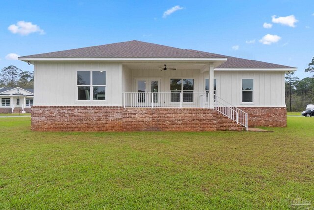 back of house featuring a yard and ceiling fan