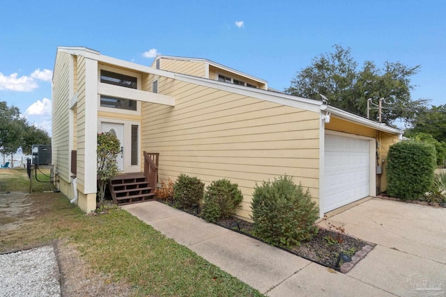 view of side of home featuring a garage