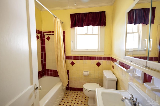 full bathroom featuring sink, tile walls, toilet, shower / tub combo, and ornamental molding