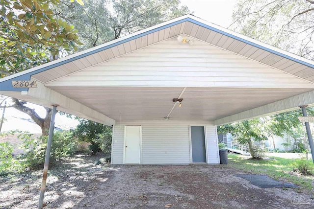 exterior space with a carport