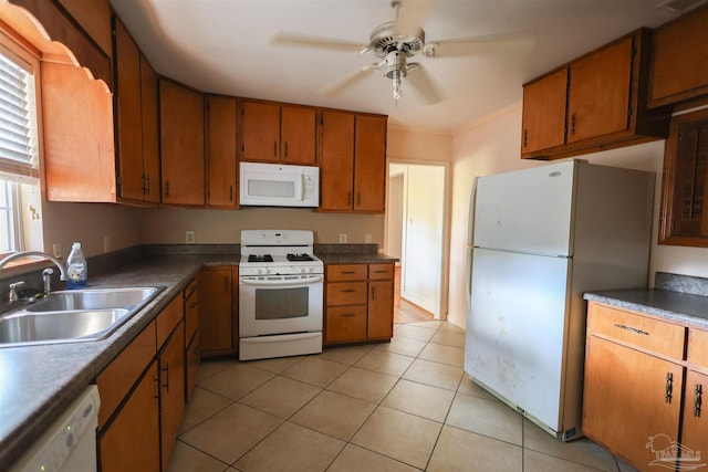 kitchen featuring ceiling fan, sink, white appliances, light tile patterned floors, and ornamental molding