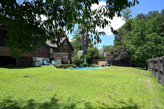 view of yard featuring a swimming pool side deck