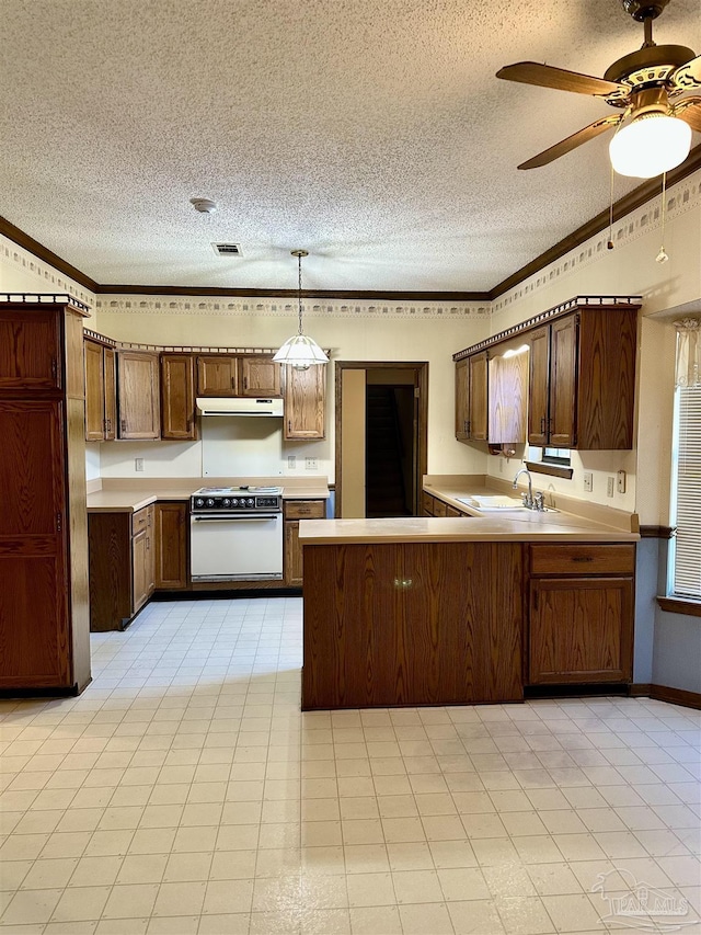 kitchen featuring sink, crown molding, hanging light fixtures, white electric stove, and kitchen peninsula