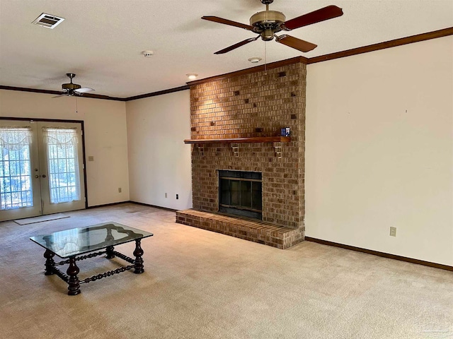 living room featuring french doors, crown molding, a brick fireplace, and light carpet