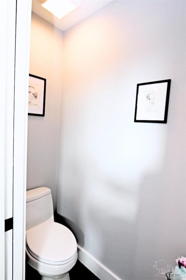 157 S Spring St, Pensacola, FL 32502 - bathroom with toilet and baseboards