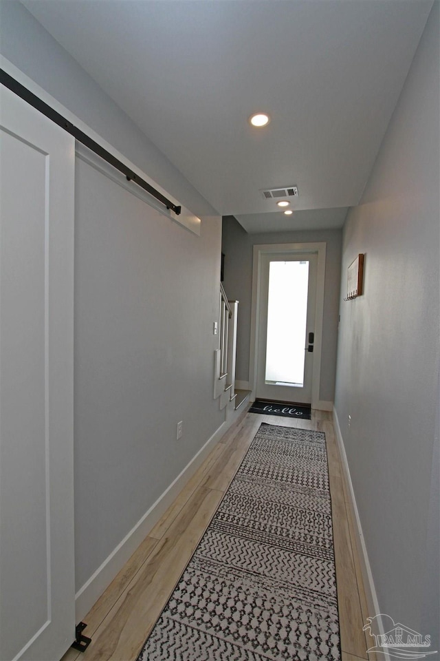 doorway featuring hardwood / wood-style flooring