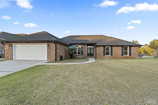 view of front facade featuring a front yard and a garage