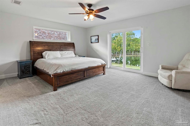 bedroom with access to exterior, carpet flooring, and ceiling fan