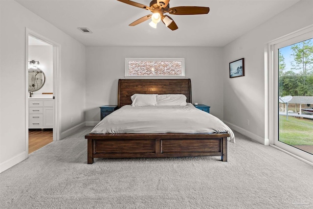 carpeted bedroom featuring access to exterior, connected bathroom, and ceiling fan