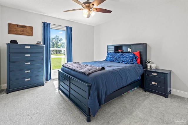 carpeted bedroom featuring ceiling fan