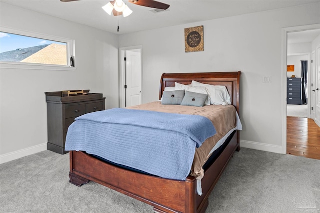 carpeted bedroom featuring ceiling fan